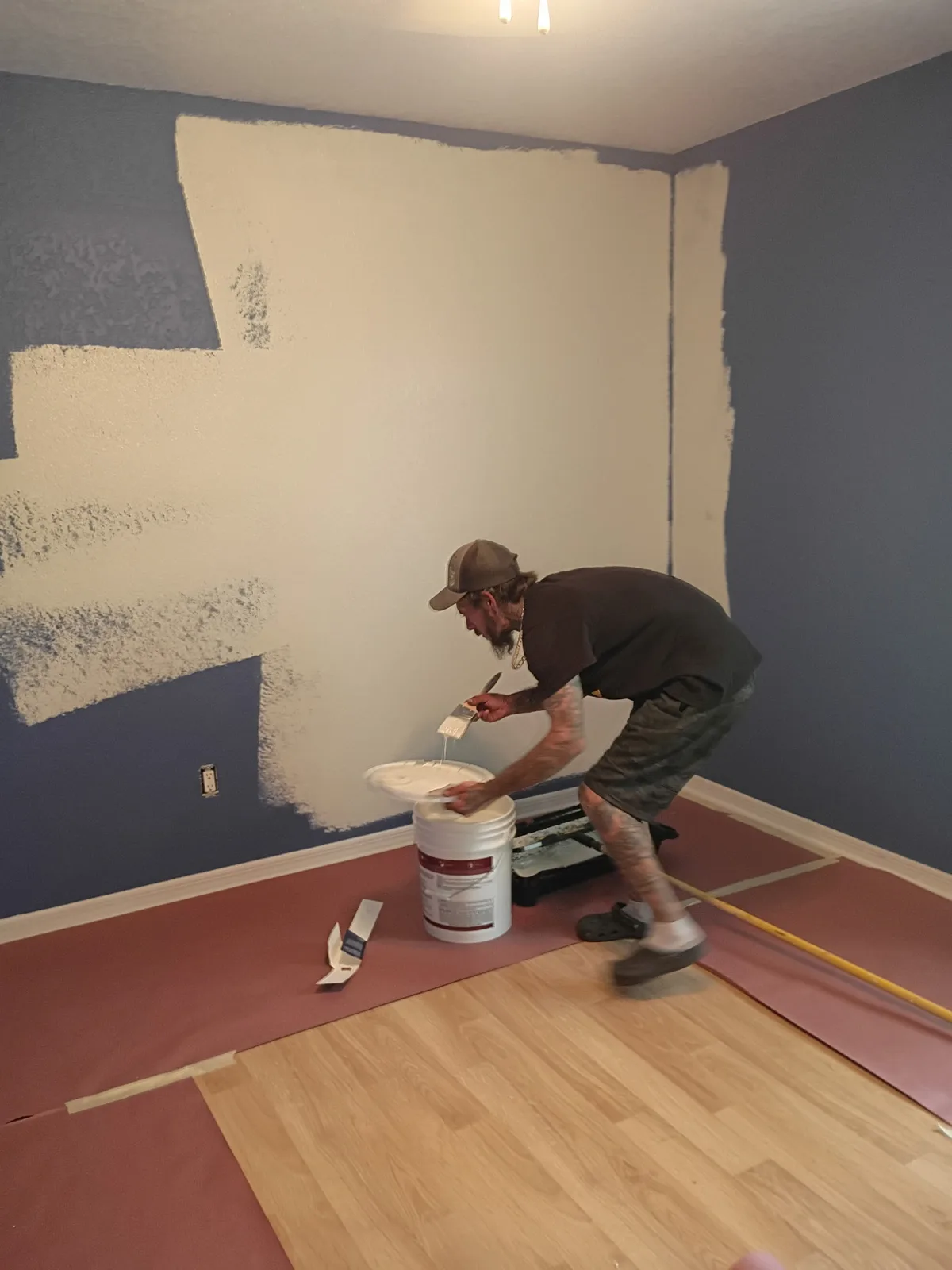Jeff rolling bedroom walls from blue-gray to white