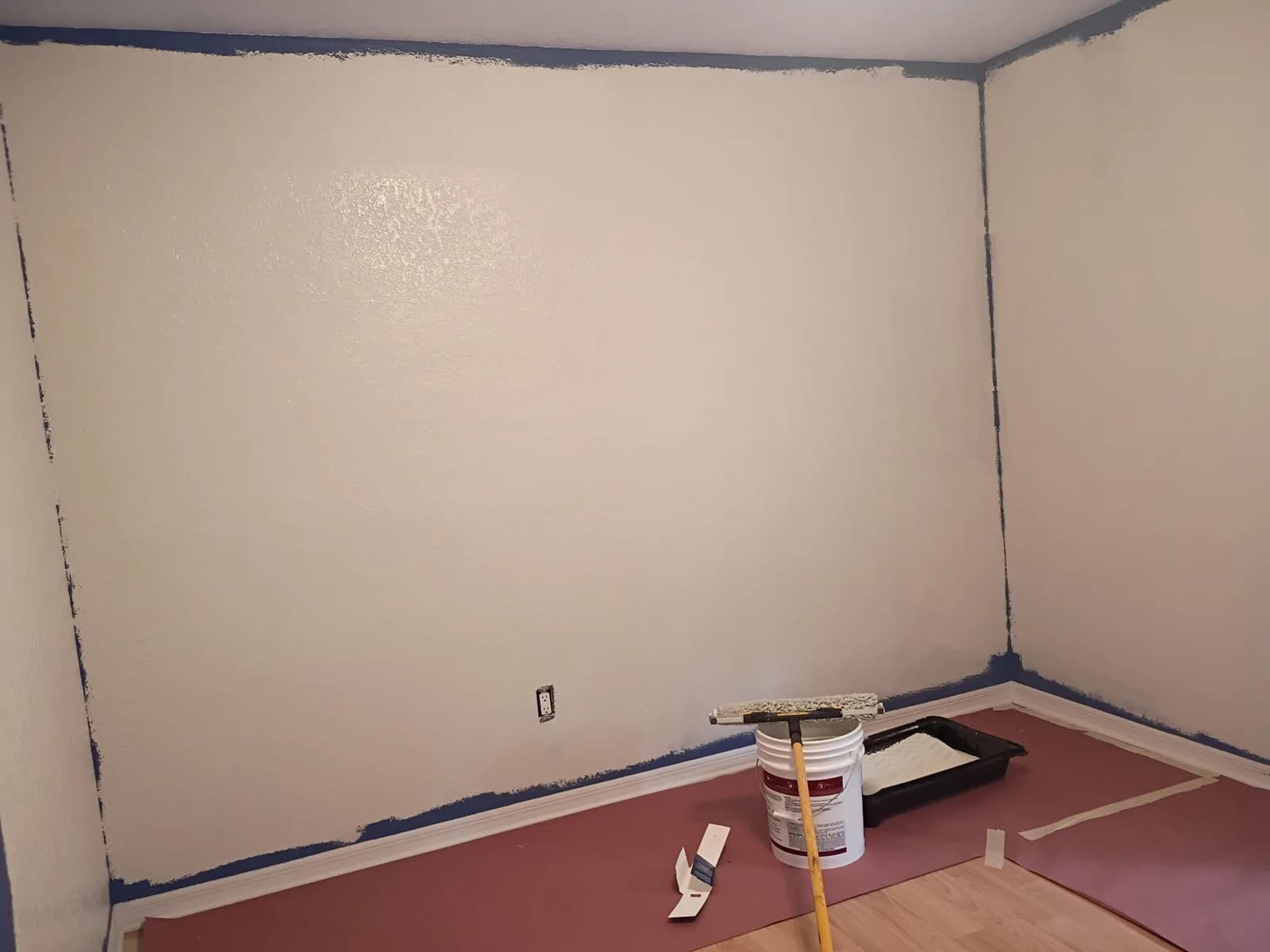 Bedroom walls transforming — fresh white over blue