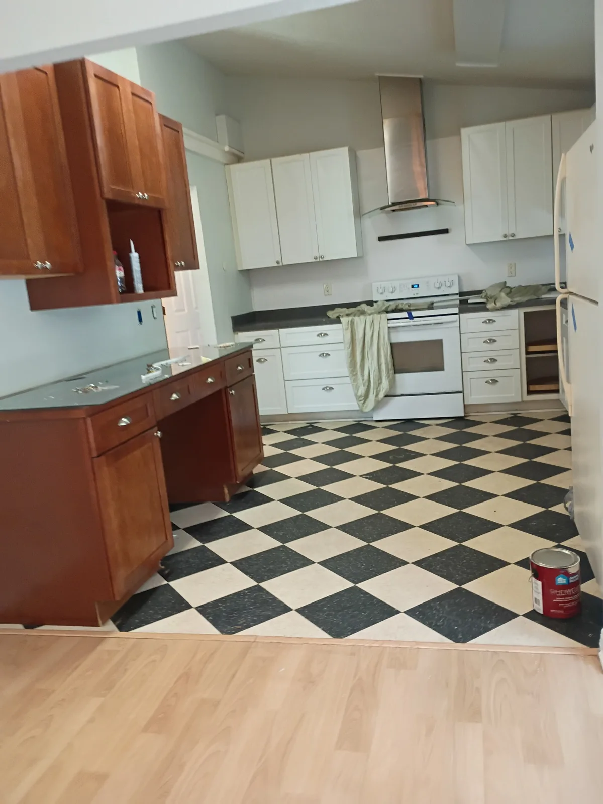 Kitchen area after painting — freshly painted light gray walls