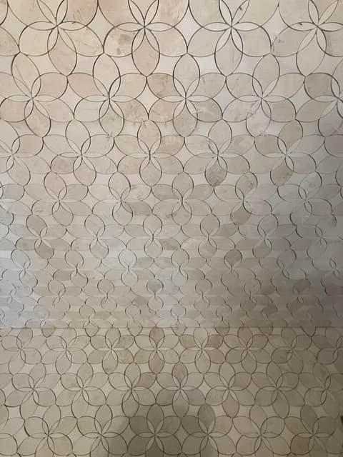 Finished marble floral-mosaic bathroom floor with a circle-and-petal pattern