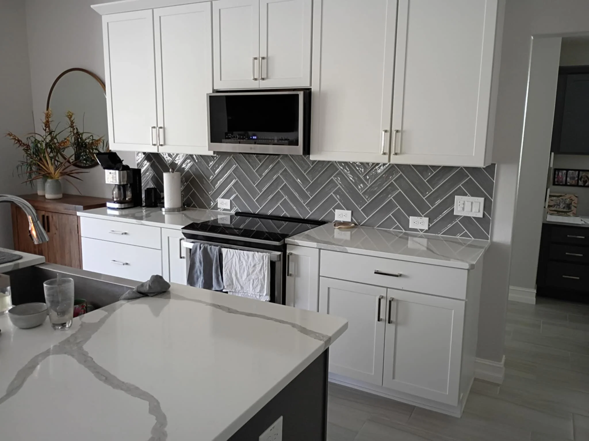 Kitchen remodel with herringbone tile backsplash