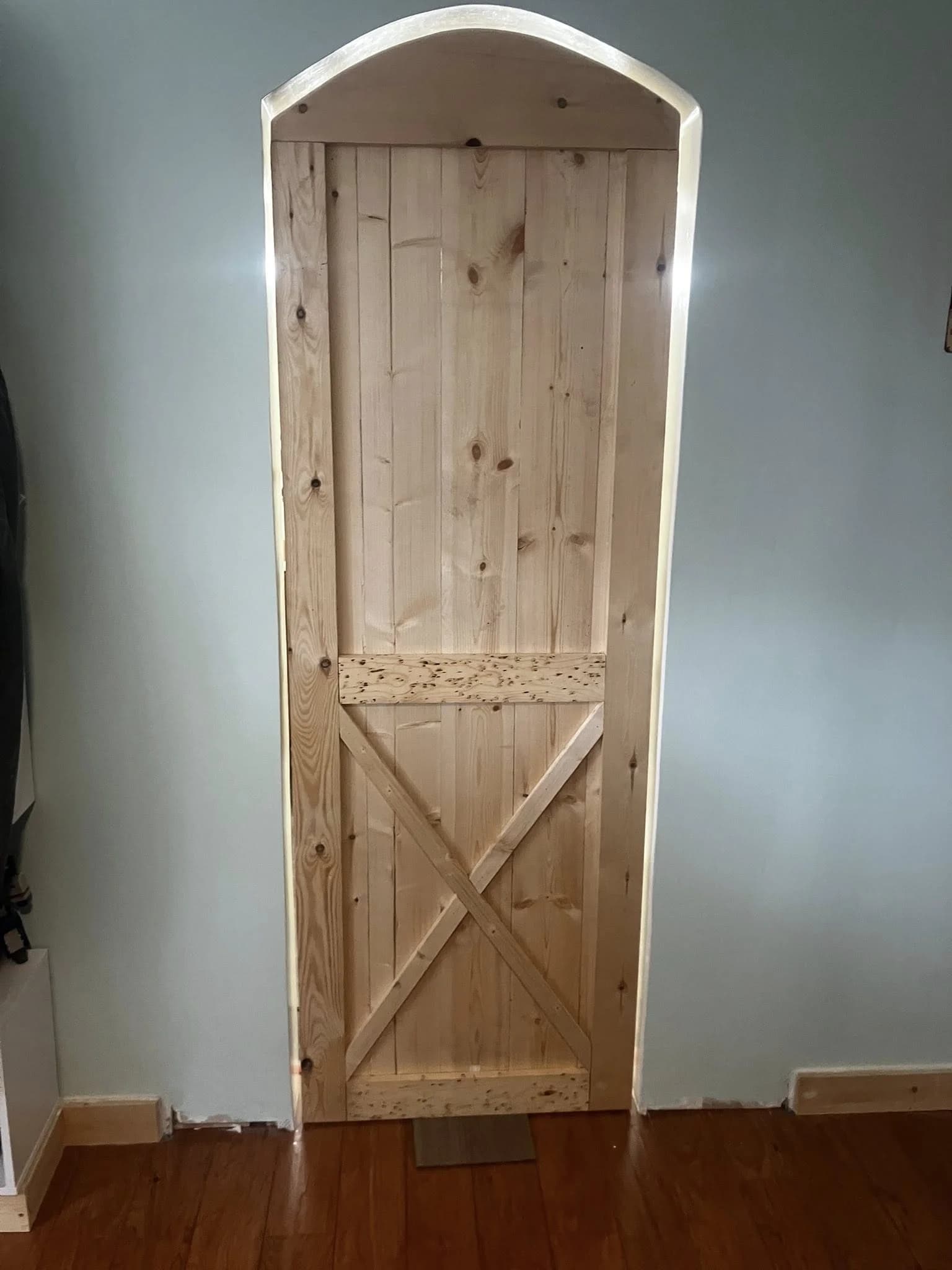 Custom barn door and archway framing in an interior home remodel
